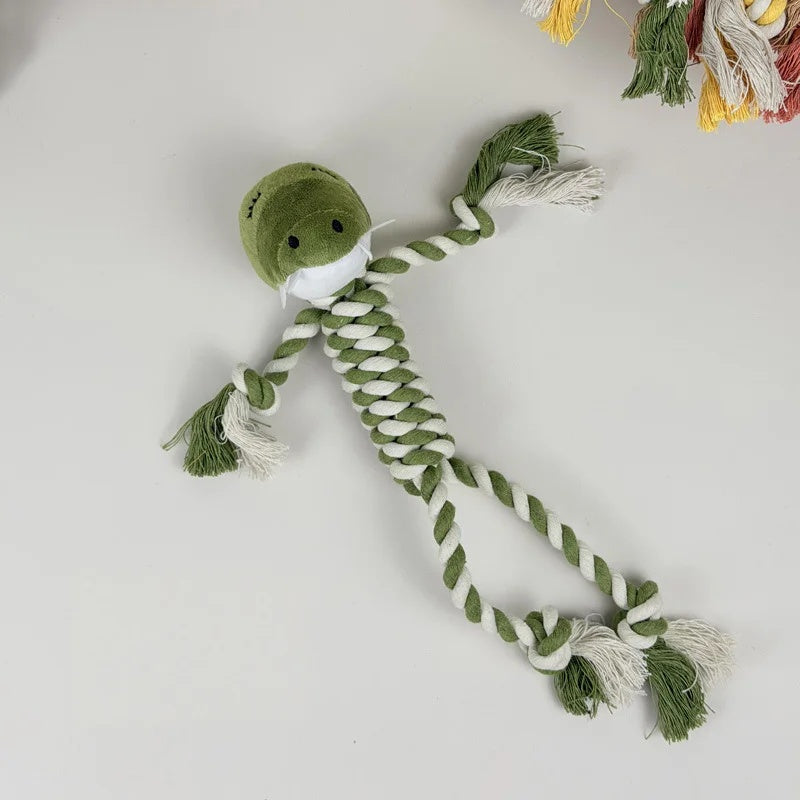 Green crocodile squeaky dog toy with a soft plush head and durable green-and-white braided cotton rope limbs.