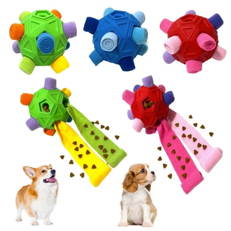 Three colorful interactive dog snuffle balls in green, blue, and red with two happy dogs looking on.
