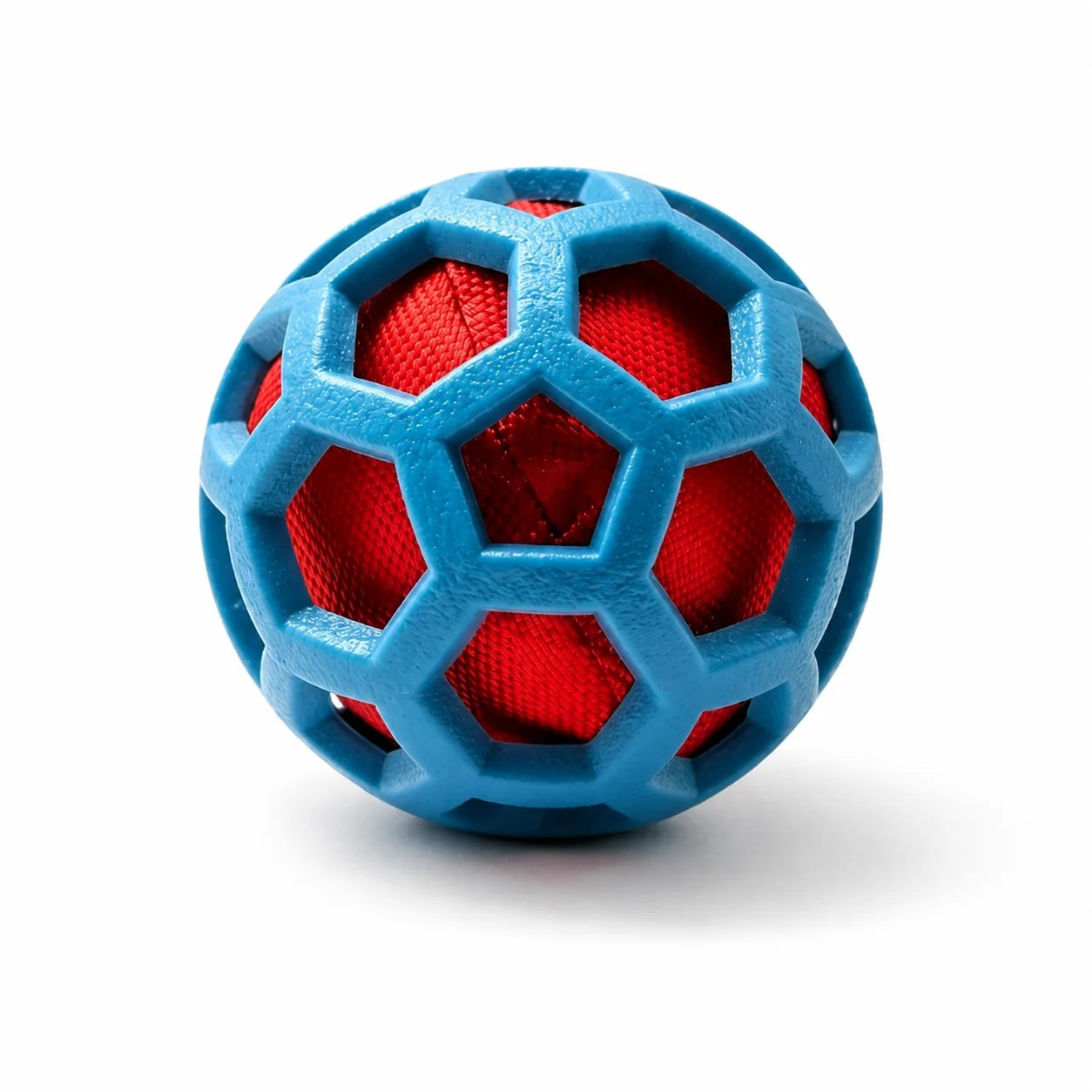Blue geometric hollow TPR dog ball with a vibrant red crinkle paper core inside, isolated on a white background.