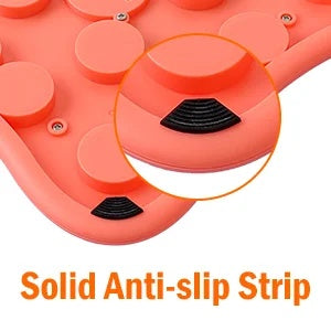 Close-up of the solid anti-slip rubber pads on the bottom of the orange plastic dog puzzle toy.