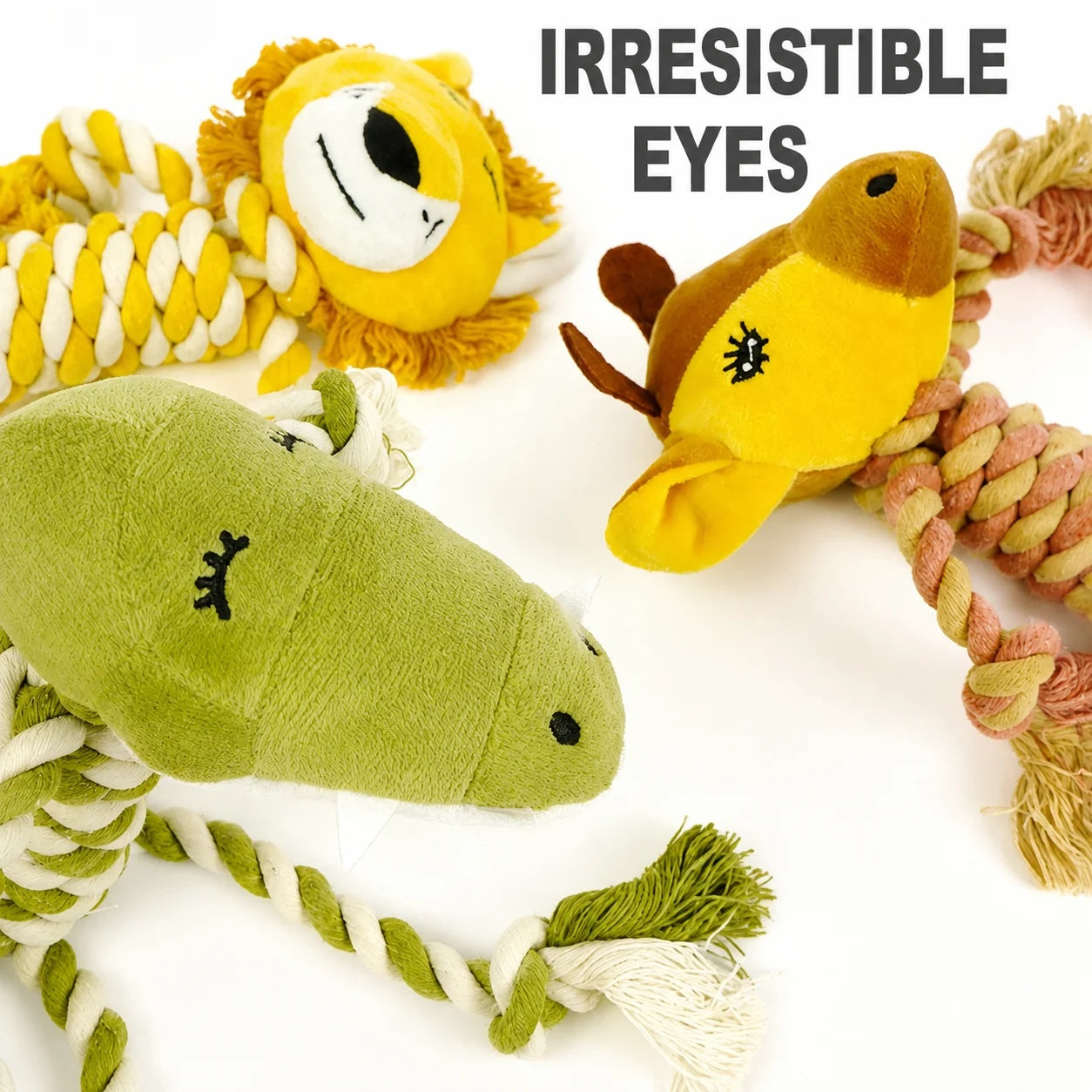 Close-up of three cute plush dog toys showing their expressive embroidered eyes and durable braided cotton ropes.