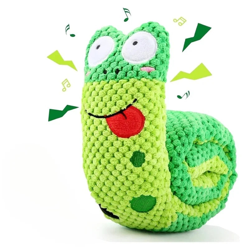 Green plush snuffle snail dog toy rolled up with a cute smiling face and red tongue.