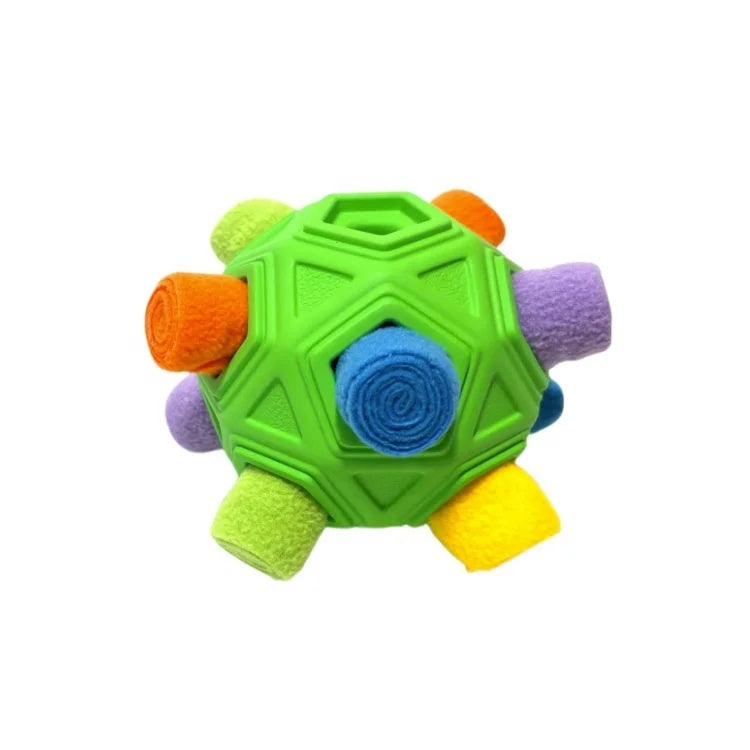 Green TPR rubber dog toy ball stuffed with colorful rolled fleece snuffle strips for treat hiding.