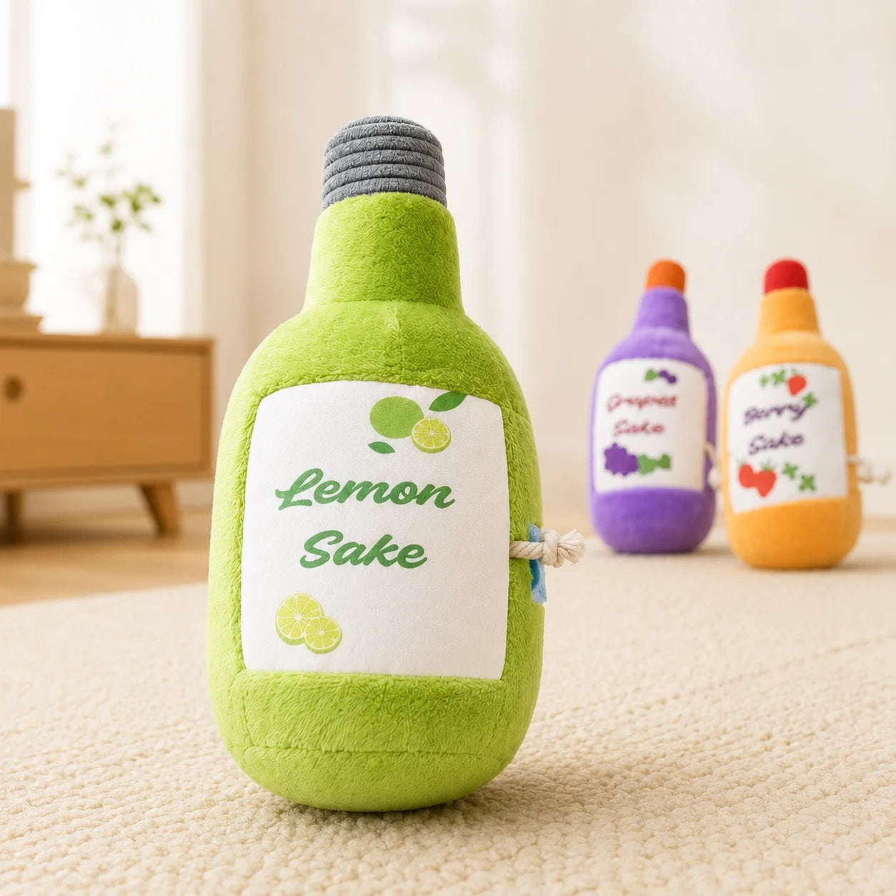 Close-up of a vibrant green Lemon Sake plush interactive dog toy with cute lemon illustrations standing on a rug.