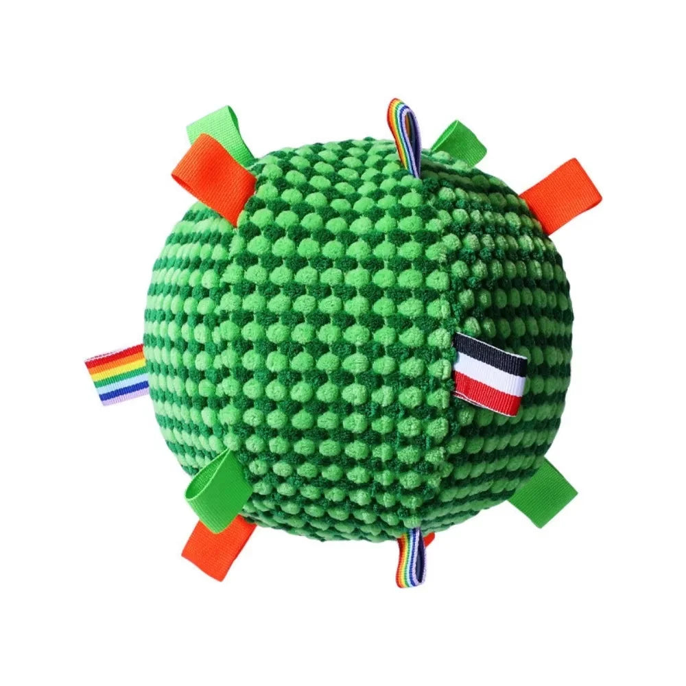 Close-up of the green textured fleece interactive dog ball toy with bright colorful tags.