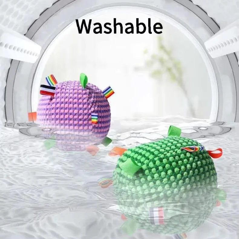 Detailed view of the soft bumpy fleece fabric and durable stitching of the interactive squeaky dog toy.