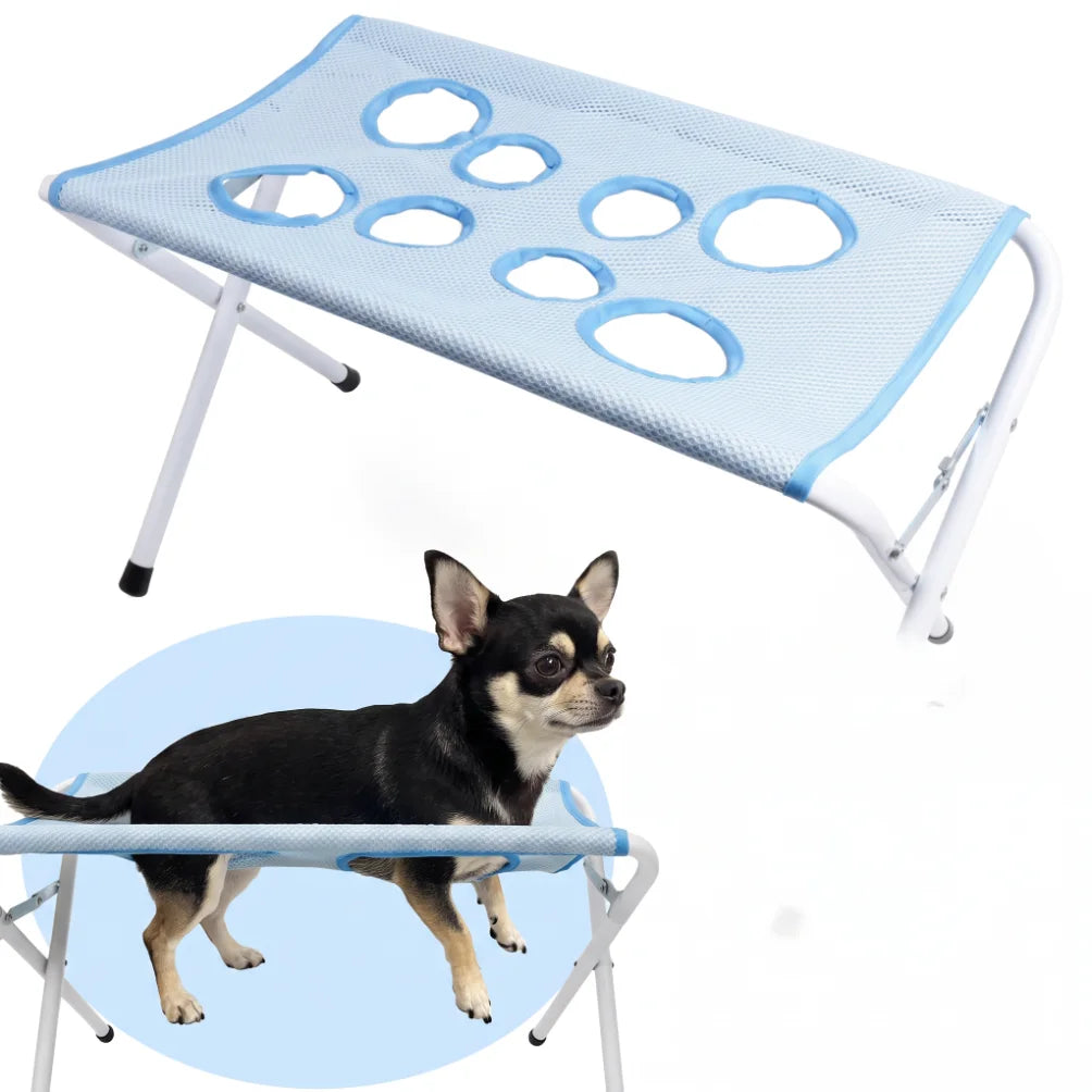 Blue mesh pet grooming hammock on a white metal stand with illustration of dog resting in it safely.