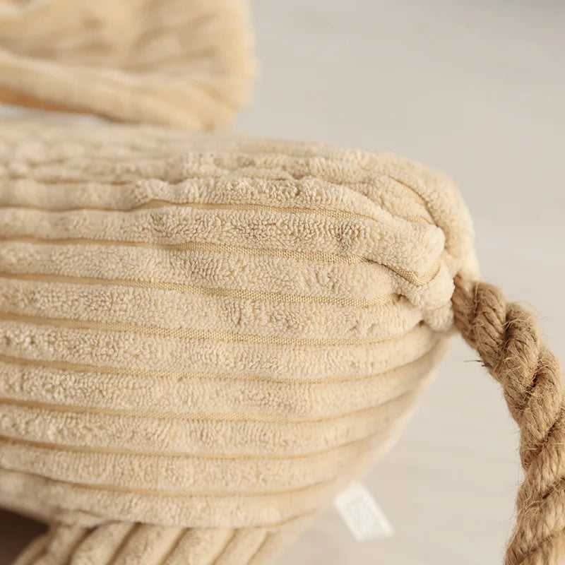 Detailed close-up showing the ribbed corduroy fabric texture and sturdy rope tail attachment.