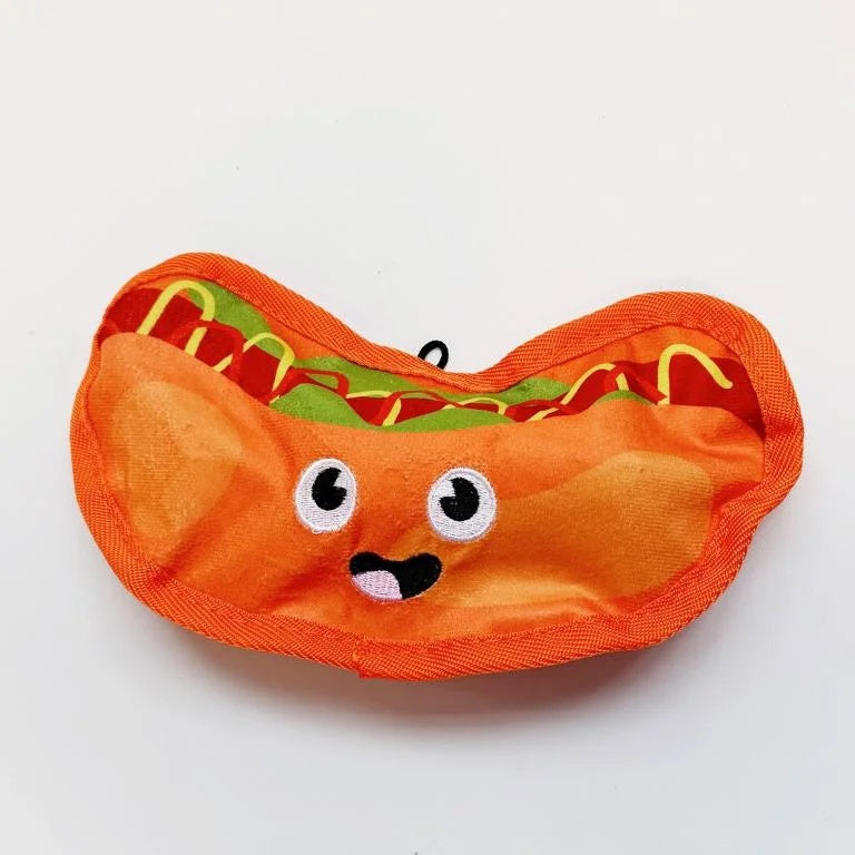 Happy hot dog plush dog toy with an embroidered smiling face, mustard, and relish details.