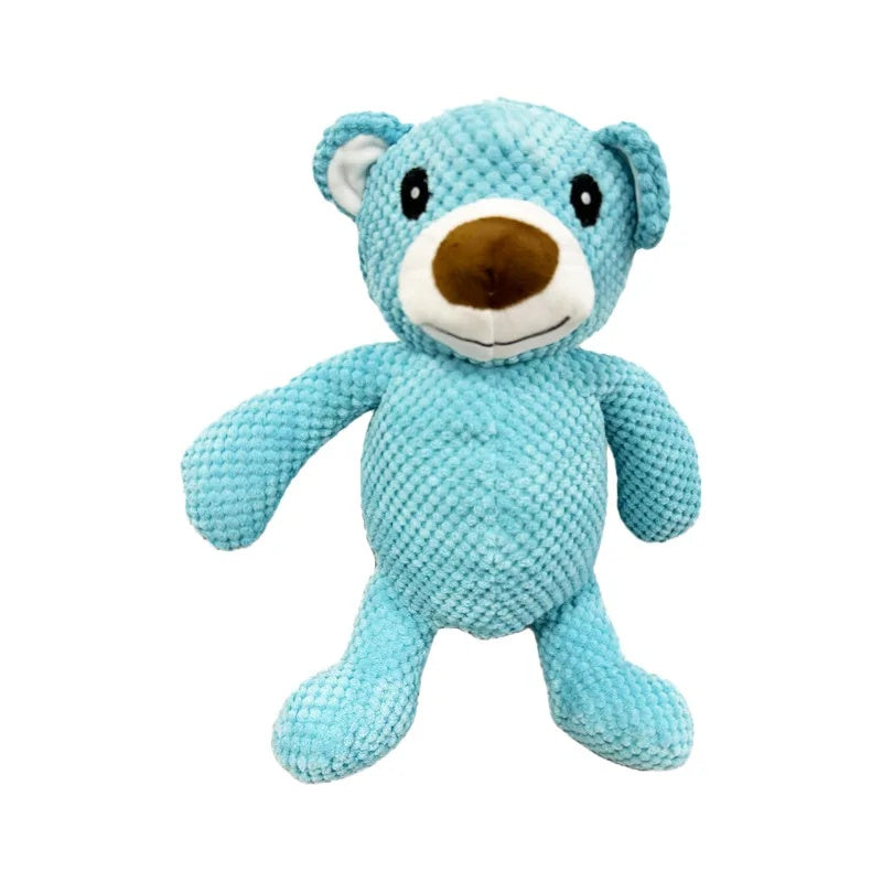 Two blue plush bear squeaky dog toys in large and small sizes sitting on a vintage woven rattan chair.