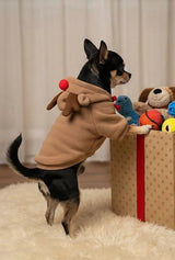 Side view of a Chihuahua standing on hind legs wearing a brown Reindeer Dog Costume with red bow detail showing perfect fit.